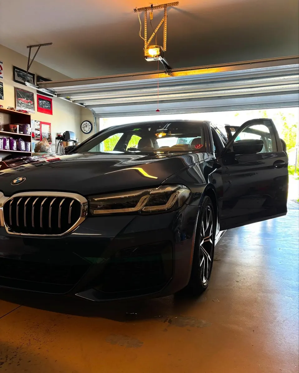 BMW 530i parked in a garage after a full detail