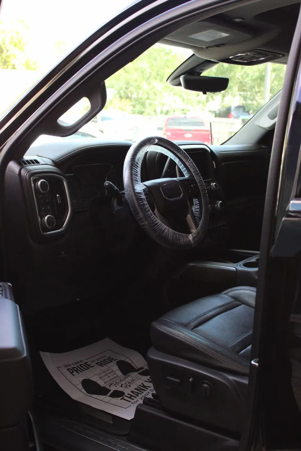 Freshly detailed truck interior with clean black leather seats