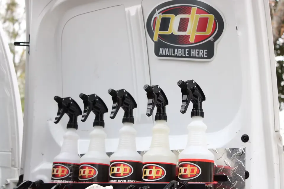 PDP detailing products lined up in the back of the Slick Shine van